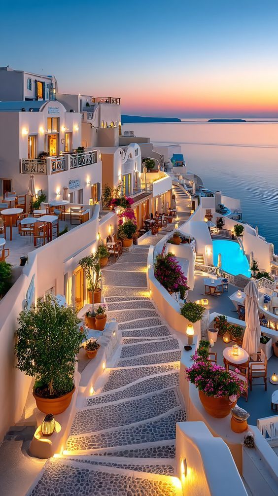 Santorini clifftop hotel at sunset — CheckerIst verifies hotels